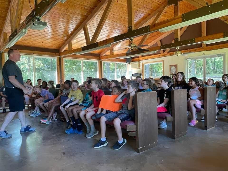 Camp gathering in wooden building