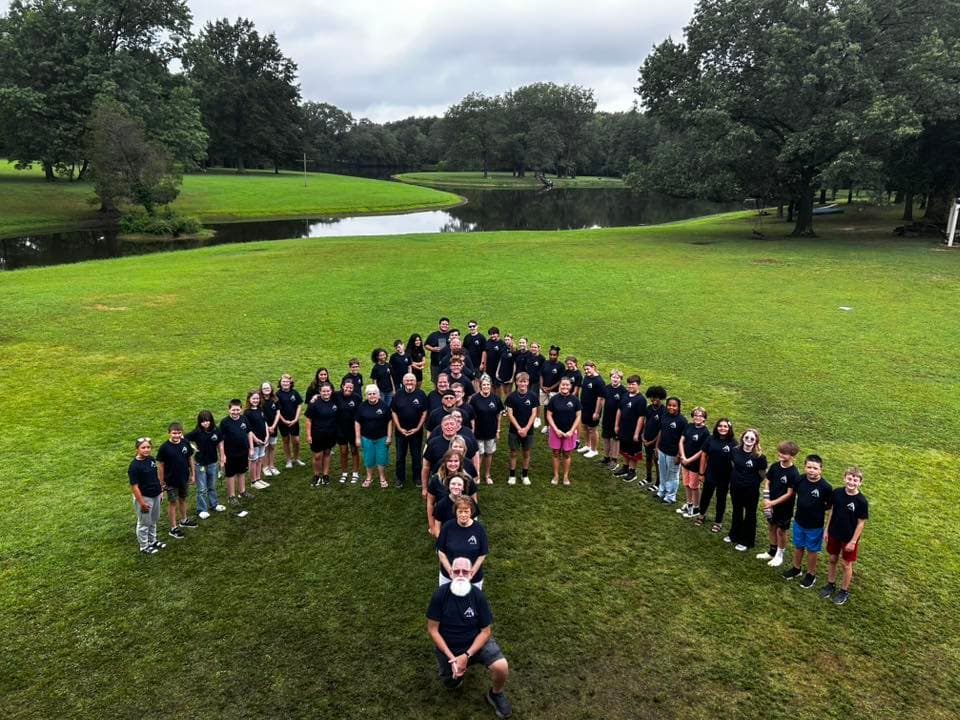 Junior High Week 2025 campers in heart formation